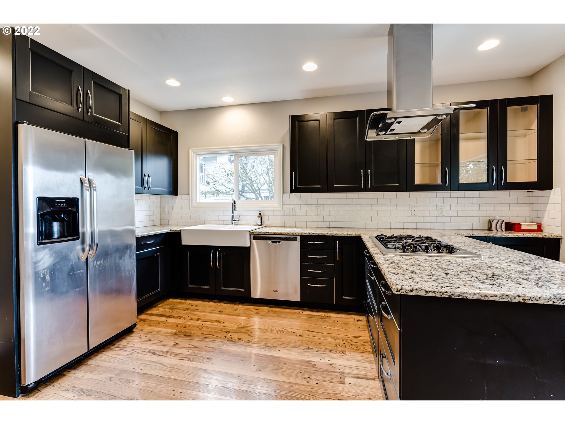 2655 Cresta De Ruta Street Eugene, OR 97403 - Photo 6 of 32 a kitchen with a stove top oven and sink