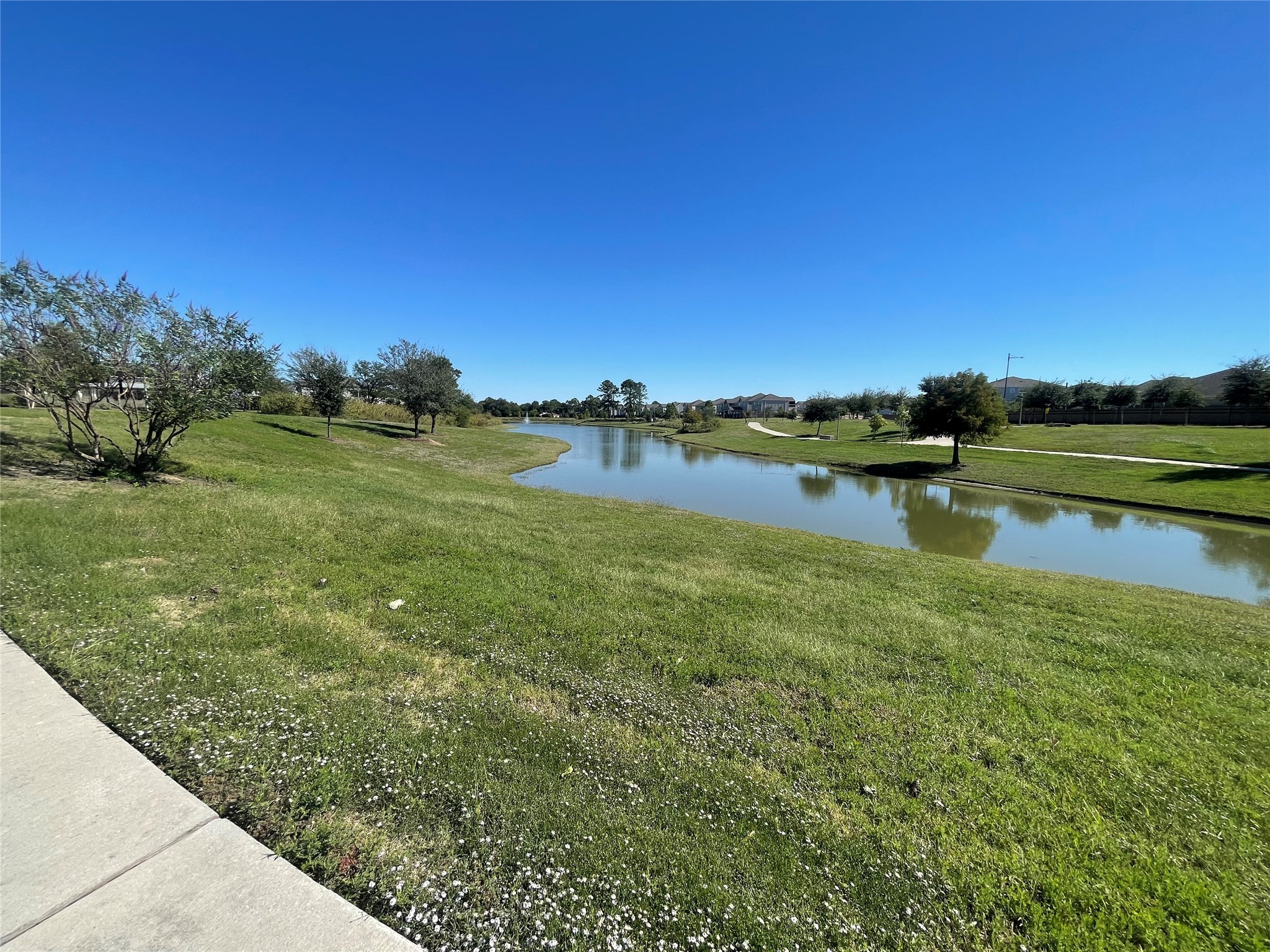 4209 Colony Pines Lane Houston, TX 77080 - Photo 30 of 30 a view of a lake with houses in the back