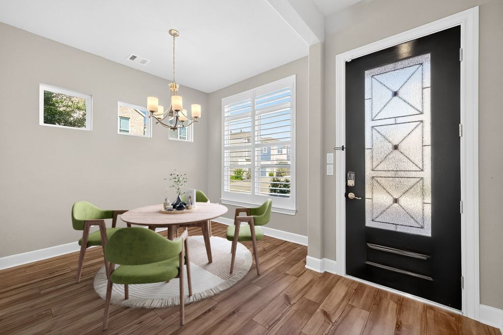4209 Colony Pines Lane Houston, TX 77080 - Photo 3 of 30 a view of a dining room with furniture window and wooden floor