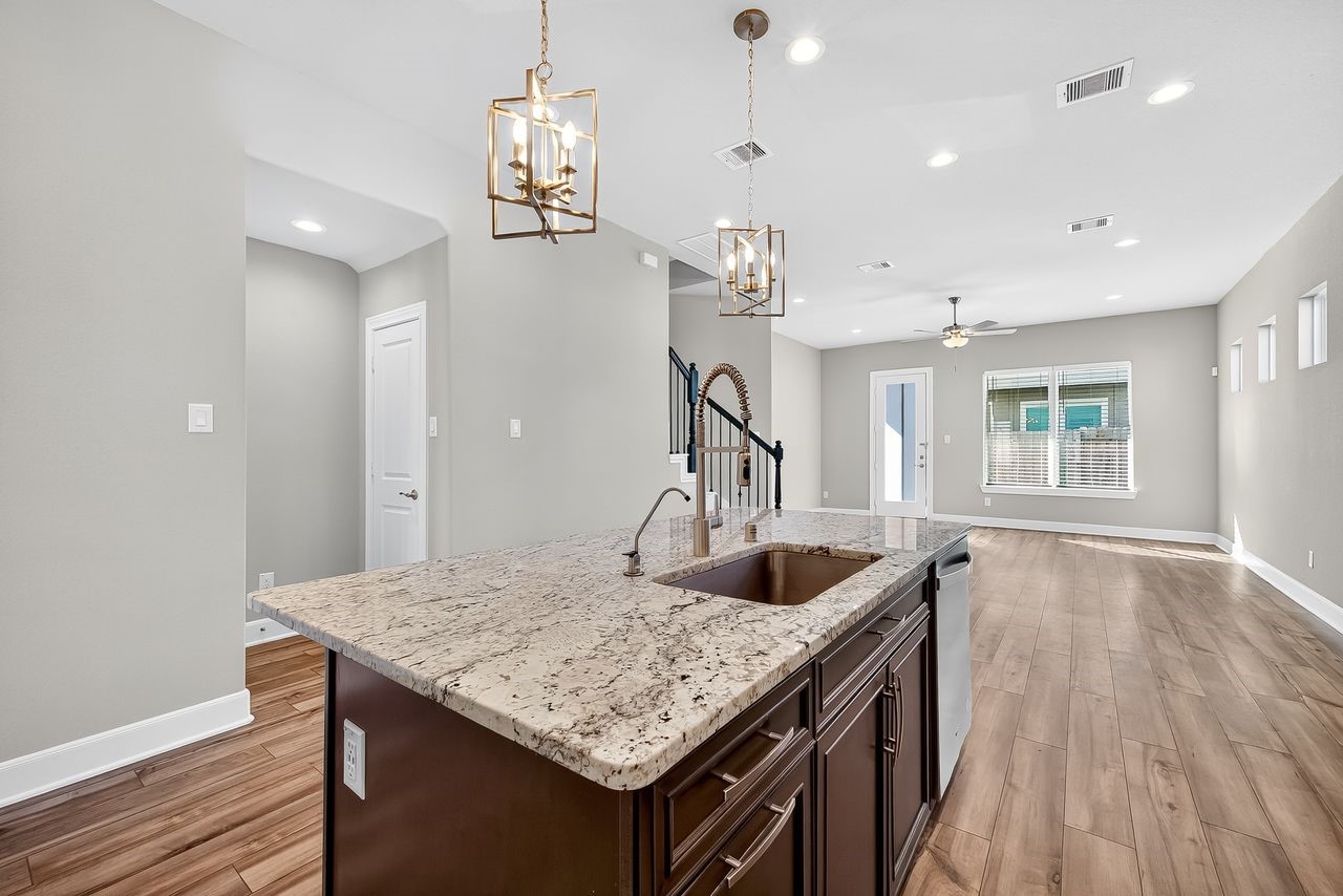 4209 Colony Pines Lane Houston, TX 77080 - Photo 8 of 30 a kitchen with granite countertop a sink and center island