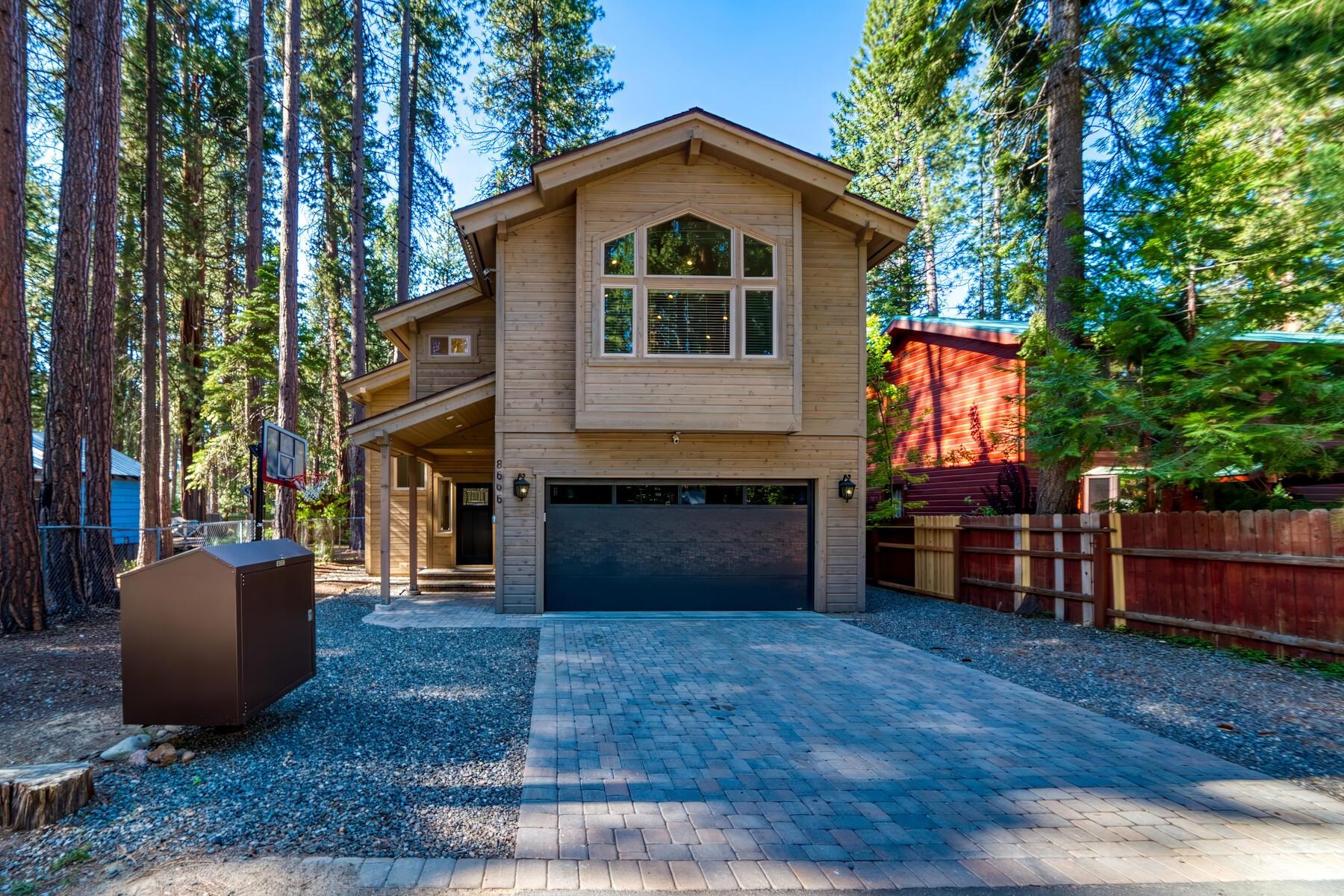 8666 Brook Avenue Kings Beach, CA 96143 - Photo 1 of 21 a front view of a house with garden