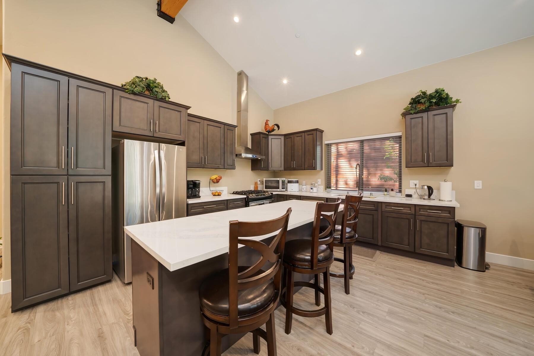 8666 Brook Avenue Kings Beach, CA 96143 - Photo 16 of 21 a kitchen with stainless steel appliances a refrigerator and a stove top oven