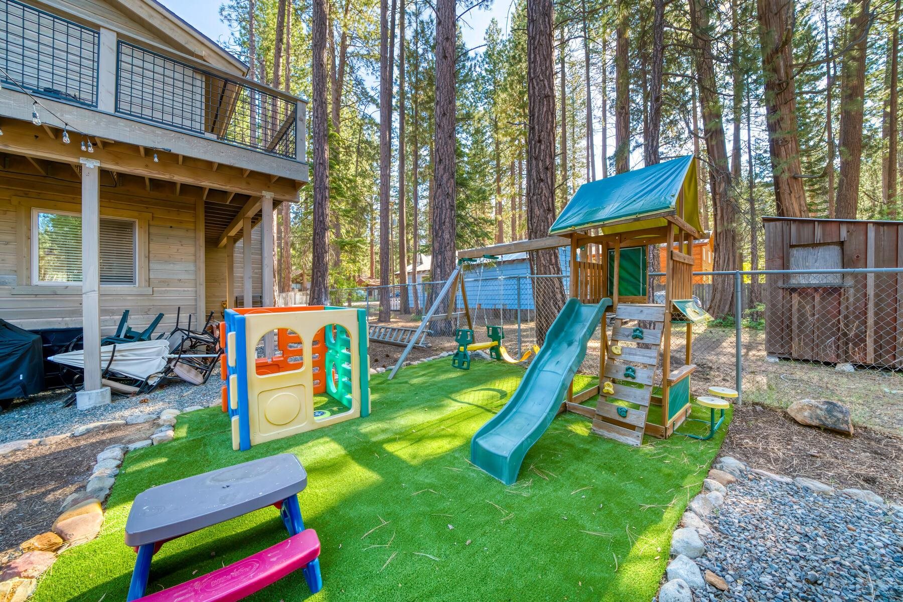 8666 Brook Avenue Kings Beach, CA 96143 - Photo 20 of 21 a view of a backyard with a table and chairs