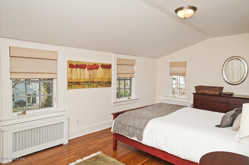 34 Spruce Street Riverside, CT 06878 - Photo 14 of 25 a bedroom with a large bed and a window