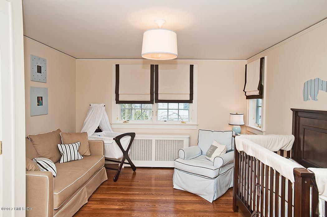 34 Spruce Street Riverside, CT 06878 - Photo 16 of 25 a living room with furniture and a large window