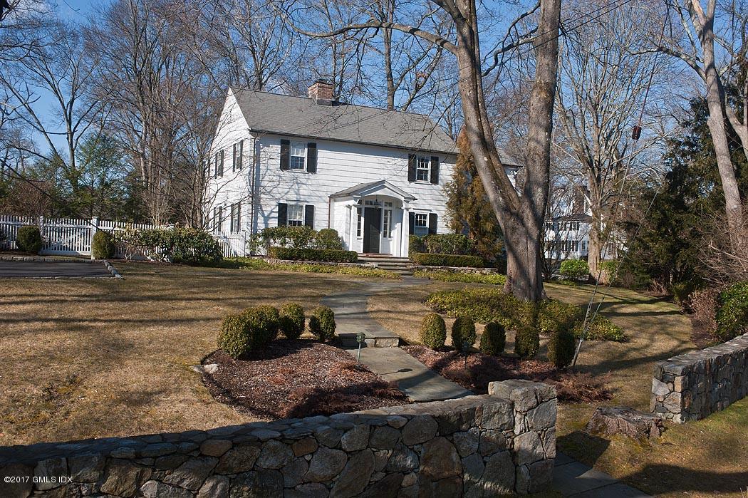 34 Spruce Street Riverside, CT 06878 - Photo 22 of 25 a front view of a house with a yard