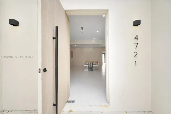 a bathroom with a glass shower door