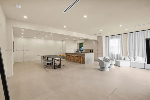 a view of a lobby with furniture and a view of living room