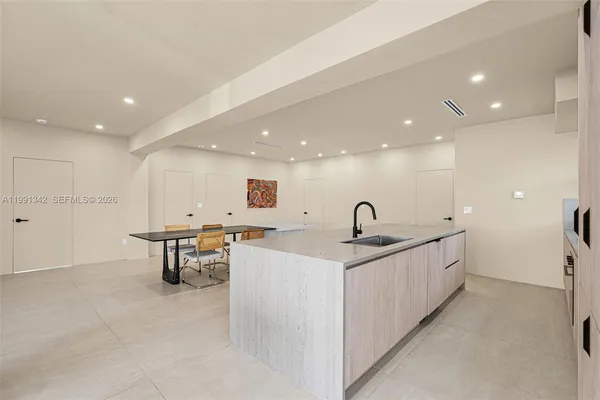 a view of a kitchen counter space and sink