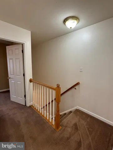 a view of a livingroom with a staircase