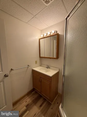 a bathroom with a sink and mirror