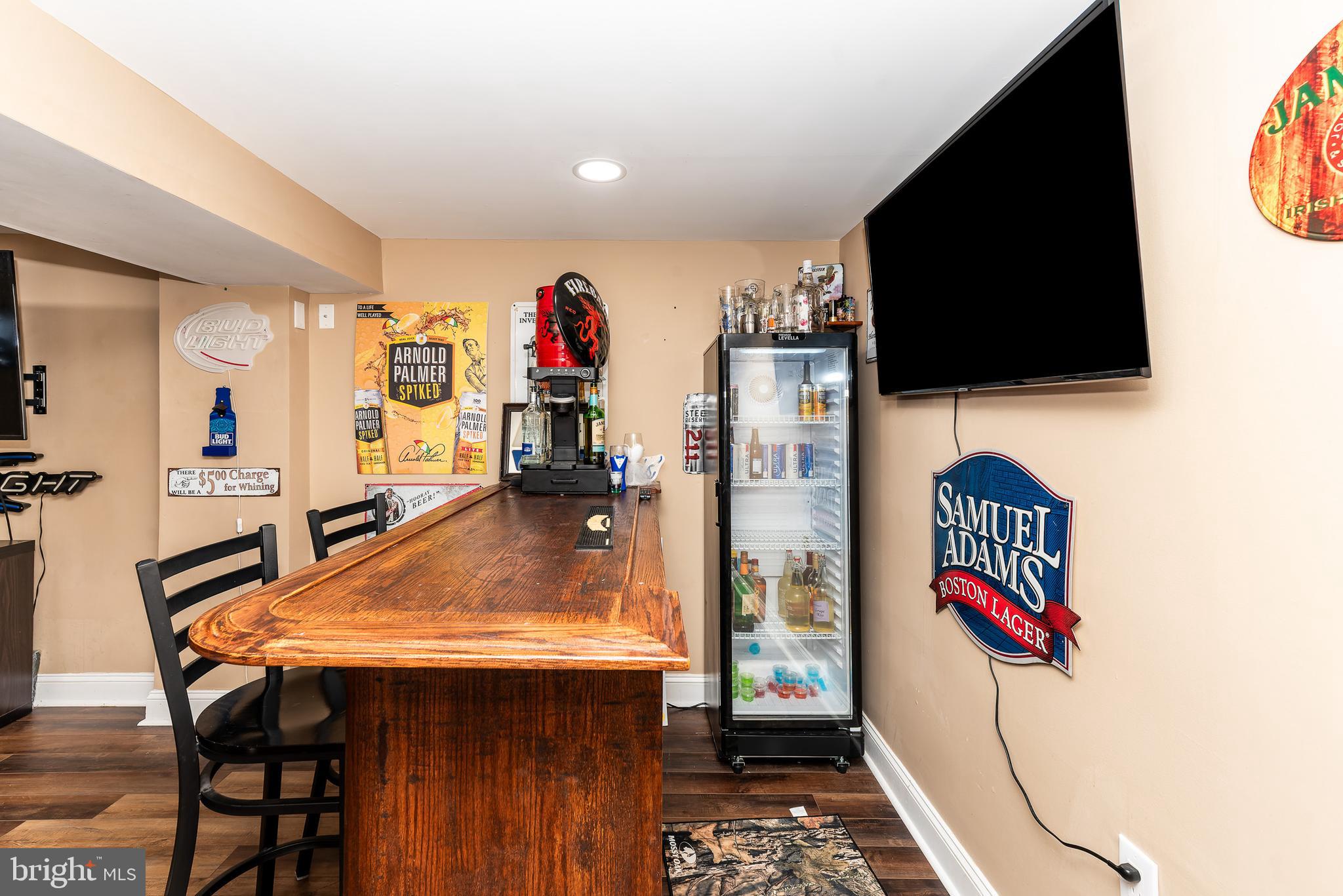 1207 Turnersville Road Pine Hill, NJ 08021 - Photo 22 of 31 a view of a living room with furniture and a flat screen tv
