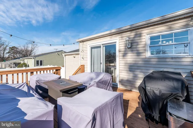 a balcony with wooden floor seating