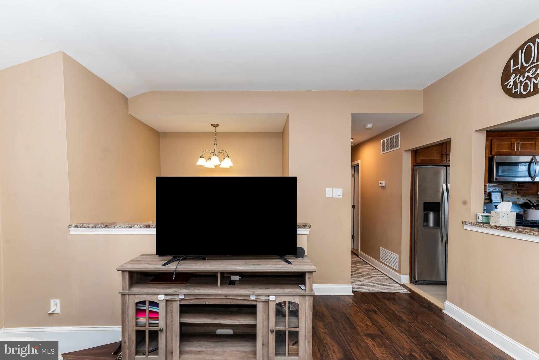 1207 Turnersville Road Pine Hill, NJ 08021 - Photo 6 of 31 a living room with furniture and a flat screen tv