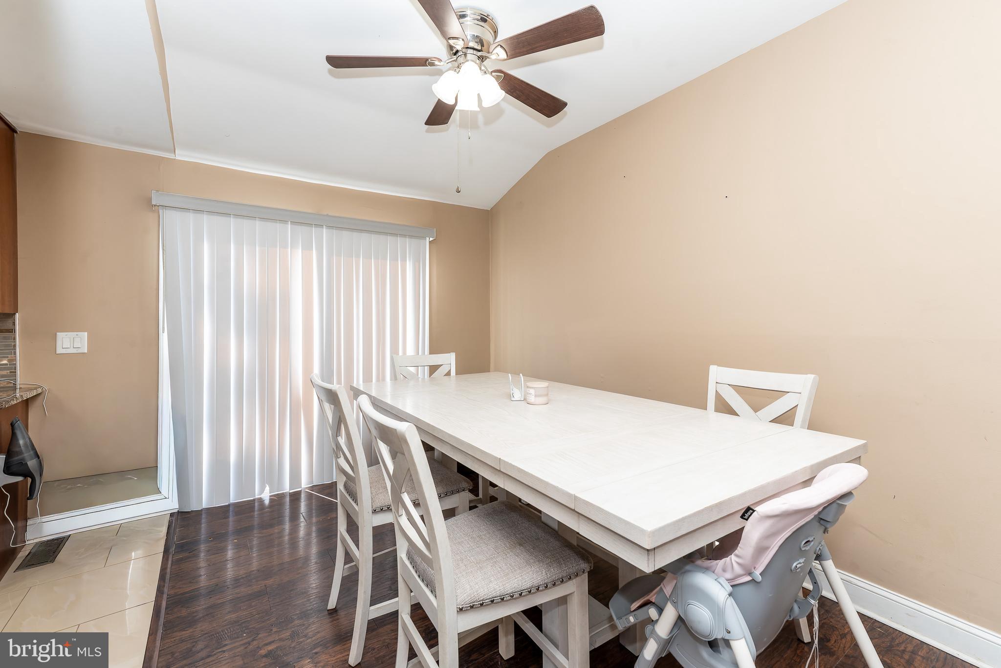 1207 Turnersville Road Pine Hill, NJ 08021 - Photo 8 of 31 a view of a dining room with furniture and a window