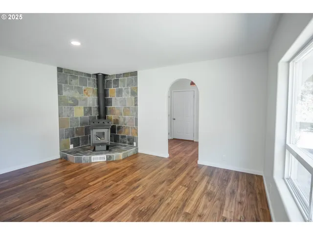 a empty room with furniture and a window