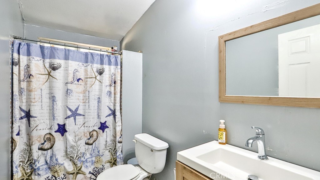 2810 11th Street Riverside, CA 92507 - Photo 11 of 19 a bathroom with a sink toilet and shower