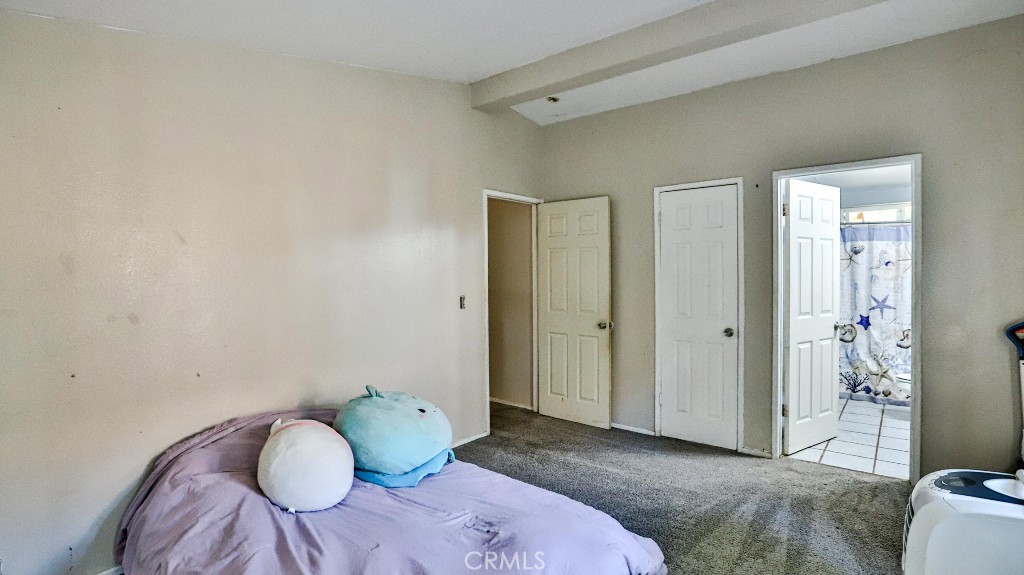 2810 11th Street Riverside, CA 92507 - Photo 10 of 19 a bedroom with a bed and wooden floor