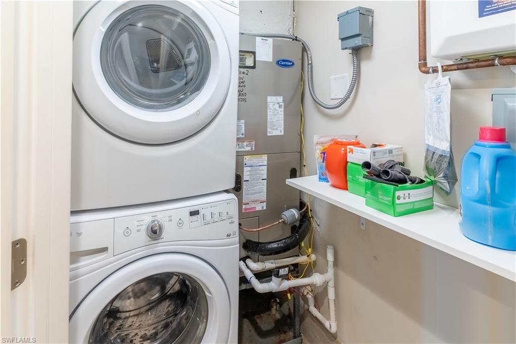 3 Bluebill Avenue, Unit 801 Naples, FL 34108 - Photo 15 of 29 a utility room with dryer and washer