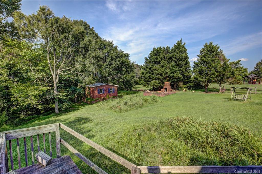 4123 White Store Road Wingate, NC 28174 - Photo 22 of 22 a view of a backyard with sitting area