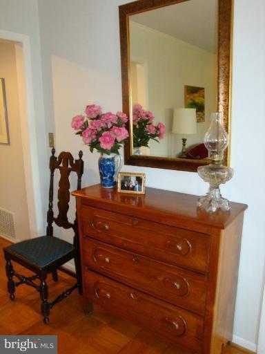 1 Hamill Road, Unit 1D Baltimore, MD 21210 - Photo 11 of 19 a room with a table chair and a dresser