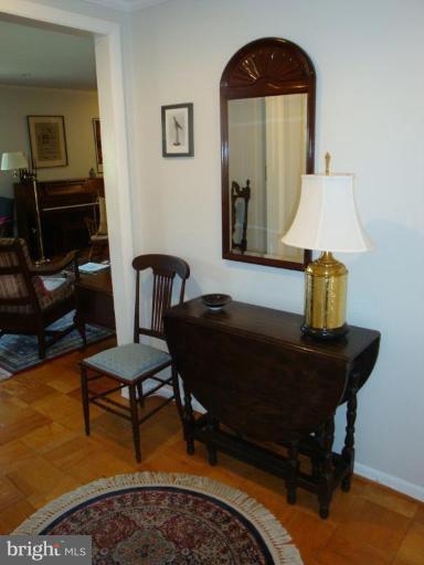 1 Hamill Road, Unit 1D Baltimore, MD 21210 - Photo 10 of 19 a living room with furniture and a lamp