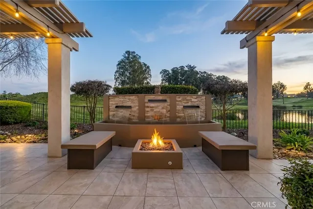 a view of a patio with couches chairs and a potted plants