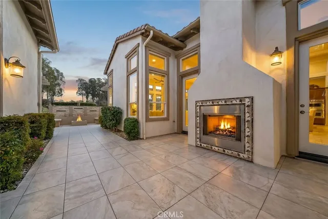 a view of a swimming pool with a patio and a yard