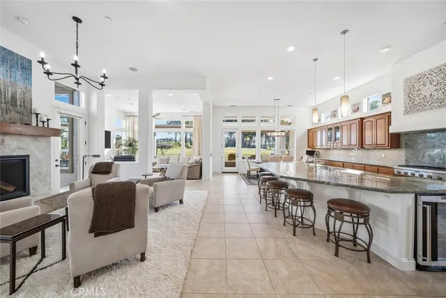 a living room with furniture fireplace and window