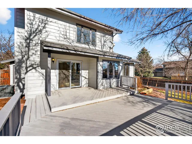 a house with swimming pool in front of it