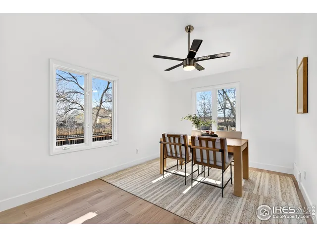 a view of a livingroom with furniture and a window