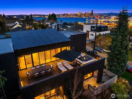 a view of a balcony with two chairs and a stove