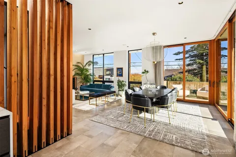 a large kitchen with kitchen island and a view of living room