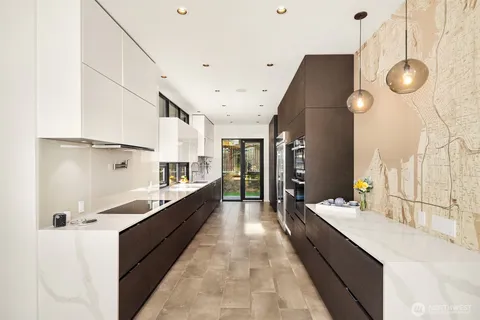 a kitchen with stainless steel appliances a refrigerator and a stove
