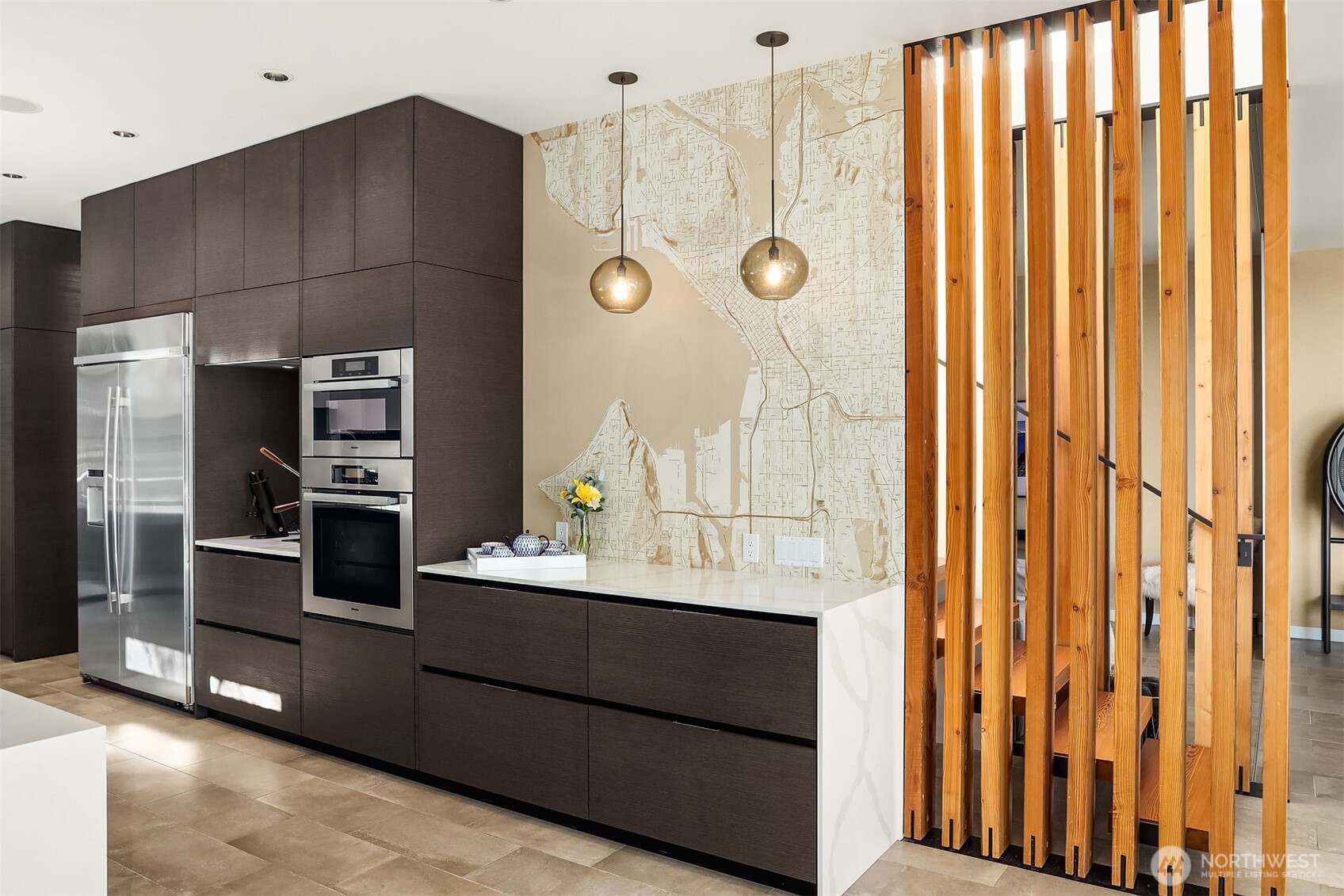 3057 36th Avenue Southwest Seattle, WA 98126 - Photo 13 of 40 a kitchen with stainless steel appliances a refrigerator and a stove