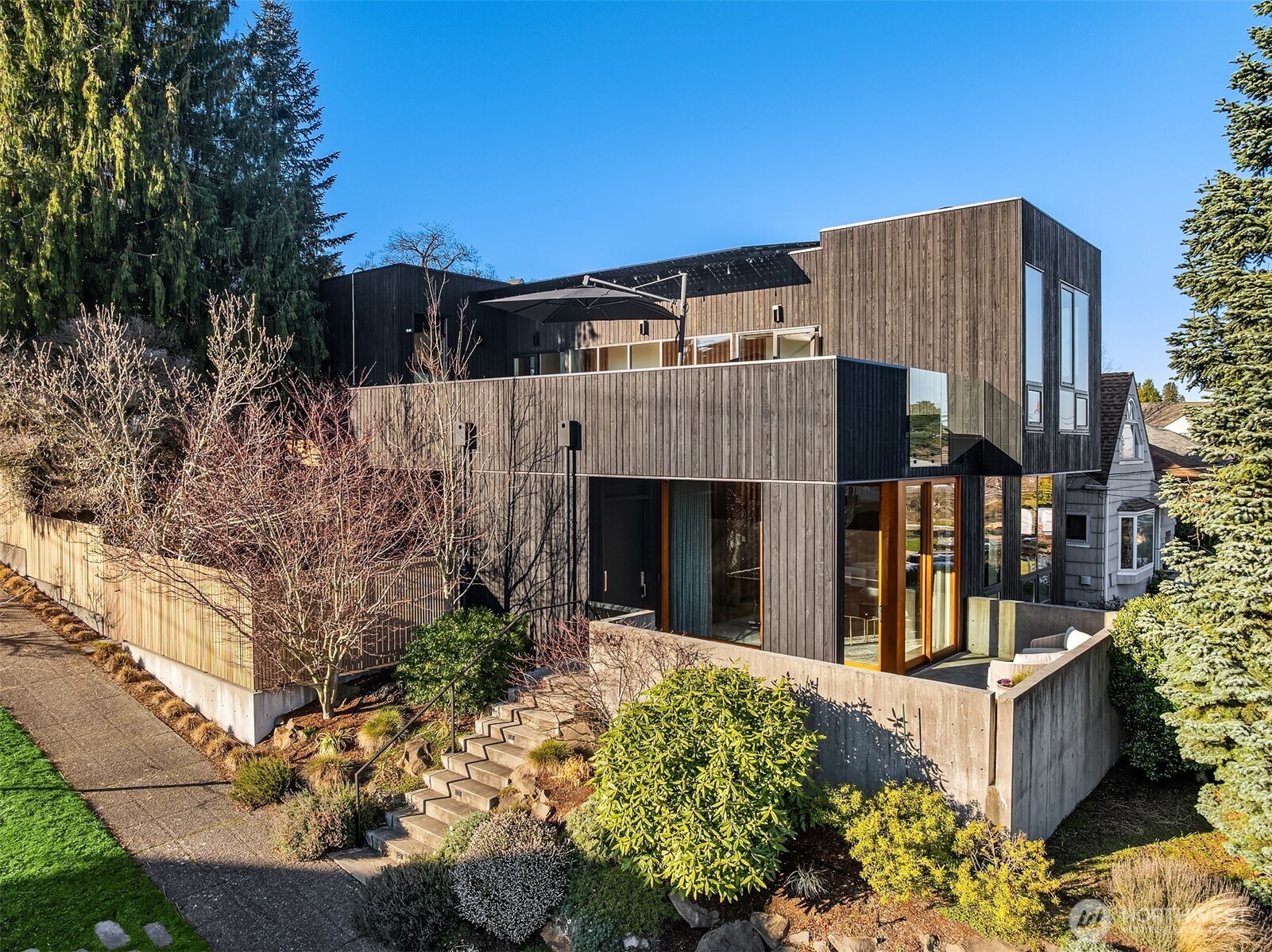 3057 36th Avenue Southwest Seattle, WA 98126 - Photo 2 of 40 a view of a house with a flower garden