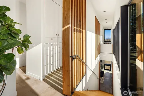 a bathroom with a sink tub double vanity and shower