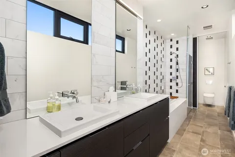 a view of a lake with boats and trees in the background