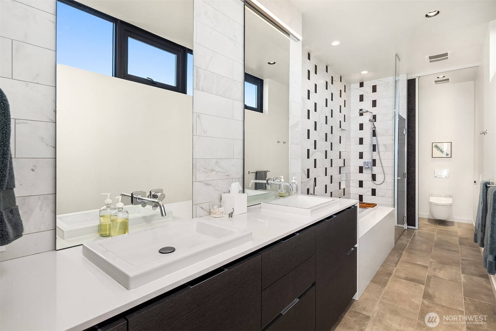 3057 36th Avenue Southwest Seattle, WA 98126 - Photo 28 of 40 a bathroom with a sink tub double vanity and shower