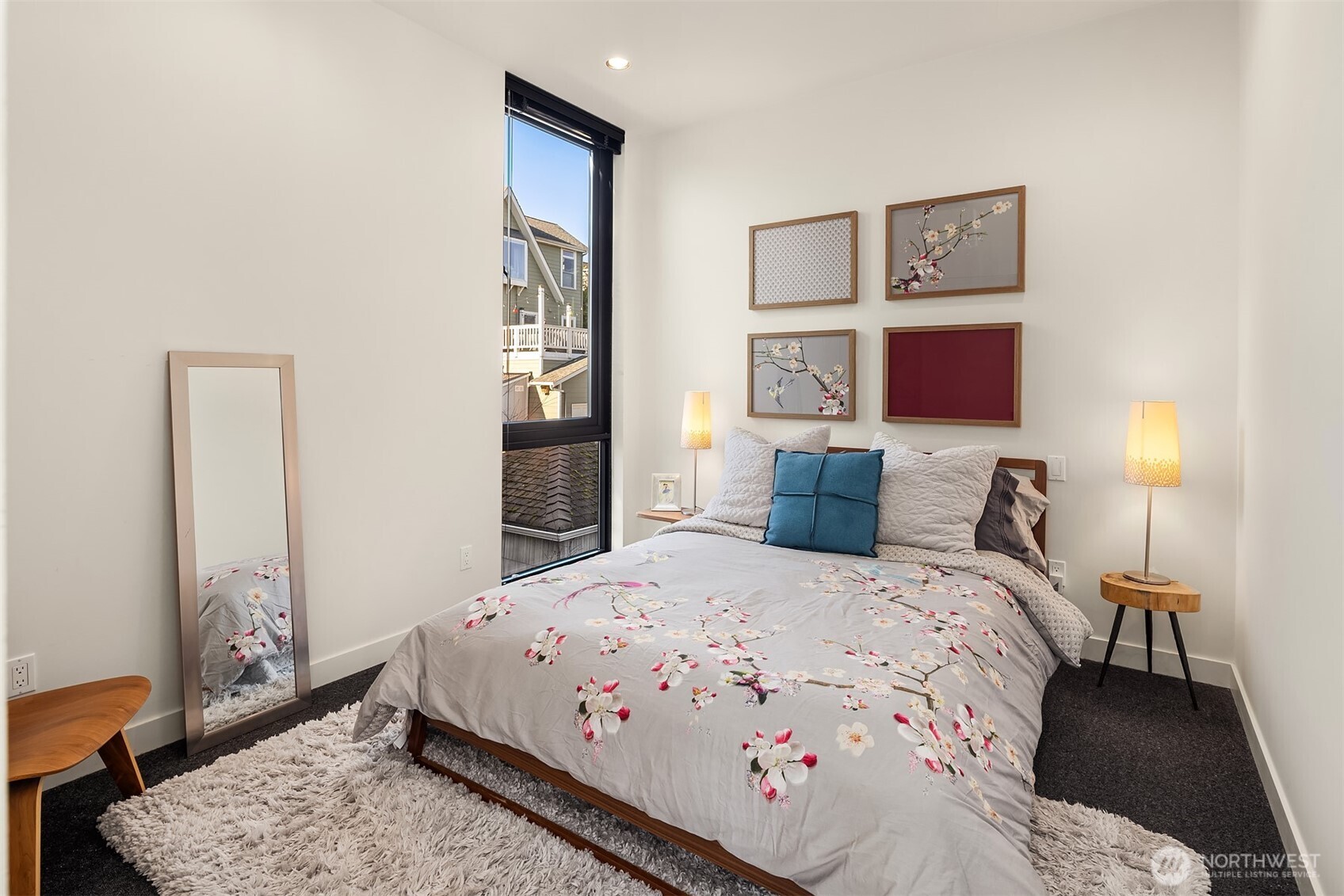 3057 36th Avenue Southwest Seattle, WA 98126 - Photo 31 of 40 a bedroom with a bed and wooden floor