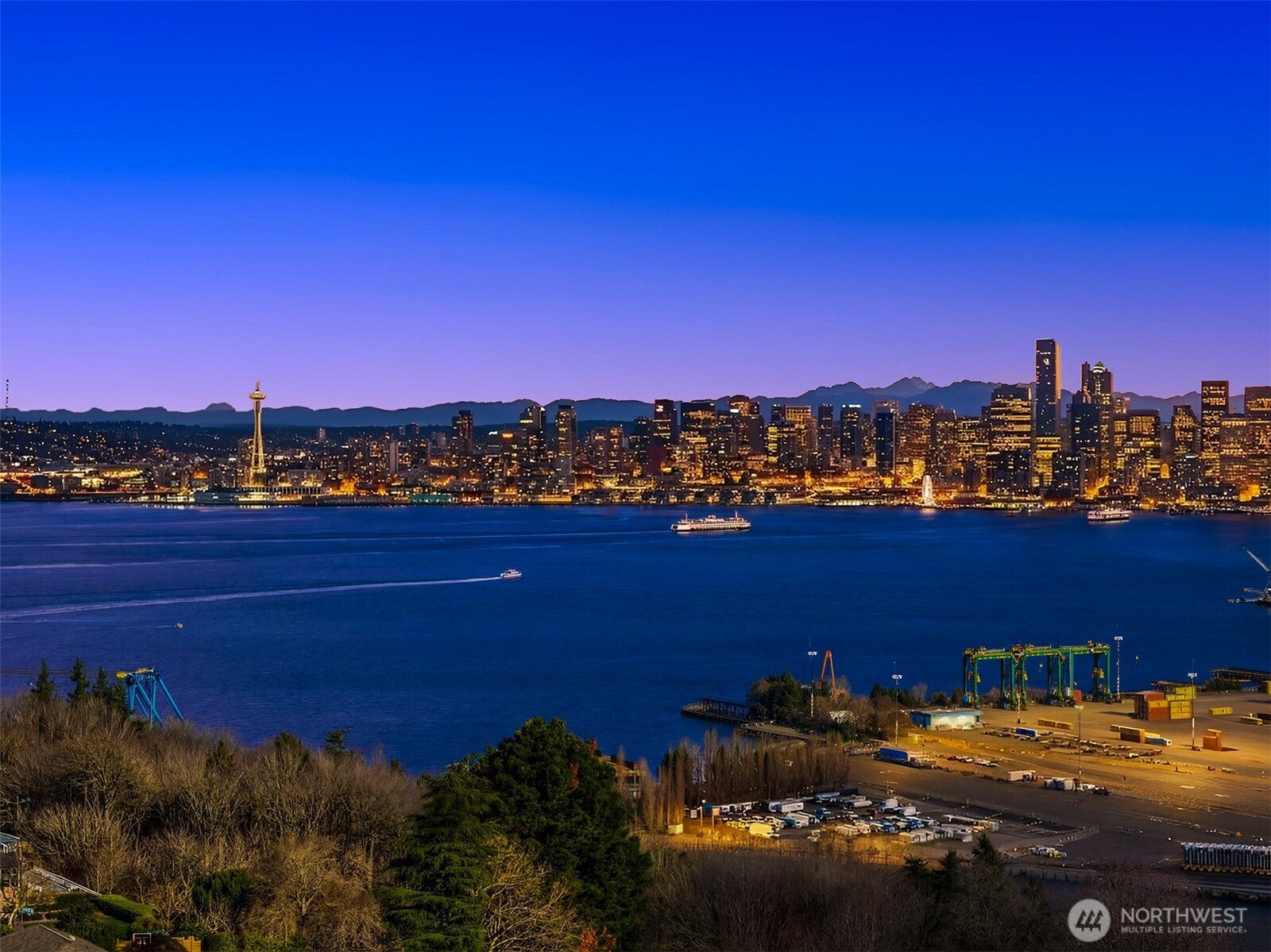 3057 36th Avenue Southwest Seattle, WA 98126 - Photo 4 of 40 a view of a city with lawn chairs