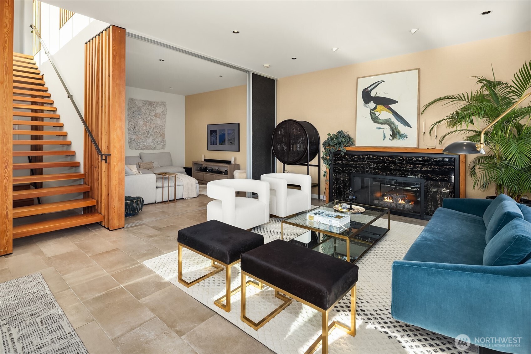 3057 36th Avenue Southwest Seattle, WA 98126 - Photo 9 of 40 a living room with furniture a fireplace and a flat screen tv