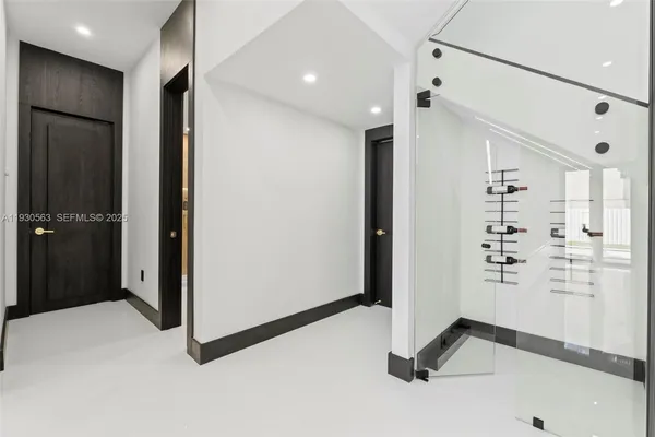 a kitchen with stainless steel appliances kitchen island a refrigerator sink a stove and cabinets