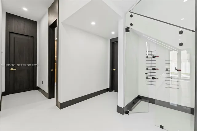 a kitchen with stainless steel appliances kitchen island a refrigerator sink a stove and cabinets