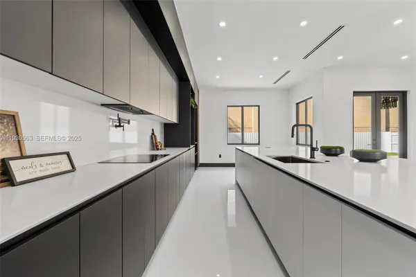 a kitchen with counter top oven and sink