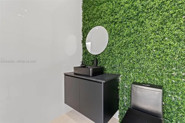 a large bathroom with a double vanity sink a mirror and a shower