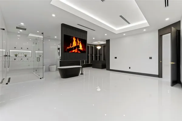 a bathroom with a bathtub and a shower