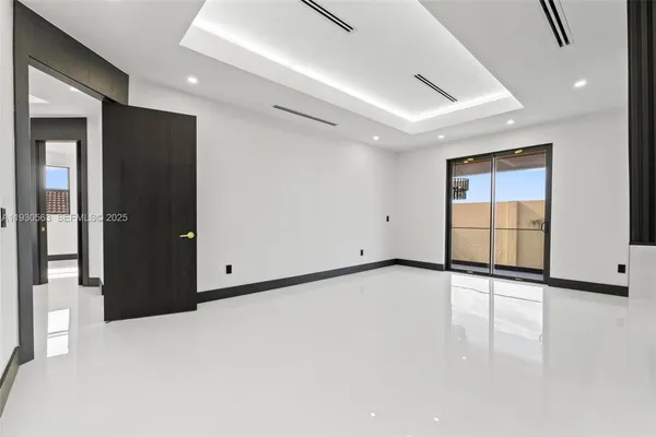 a large bathroom with a toilet a sink and a large mirror