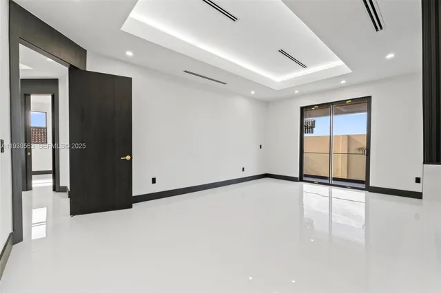 a large bathroom with a toilet a sink and a large mirror