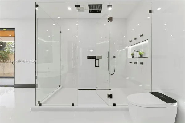 a view of a living room and entryway